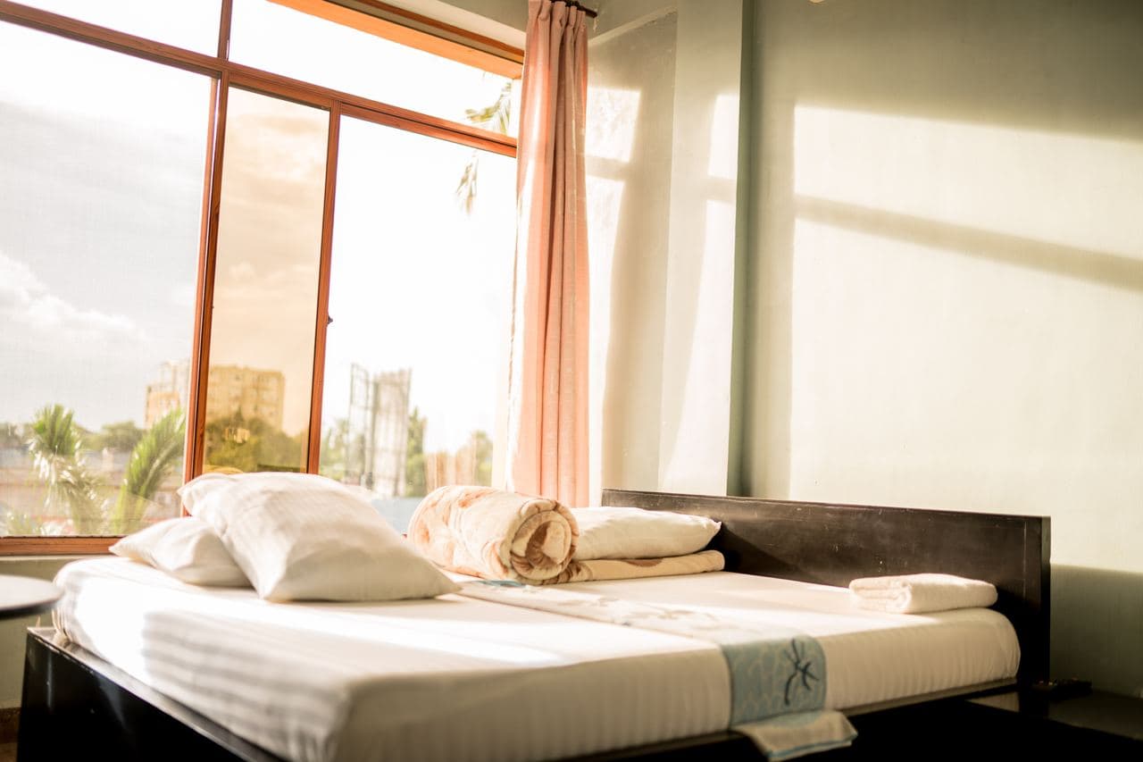 Sunlit double bedroom at Mountain G Hotel