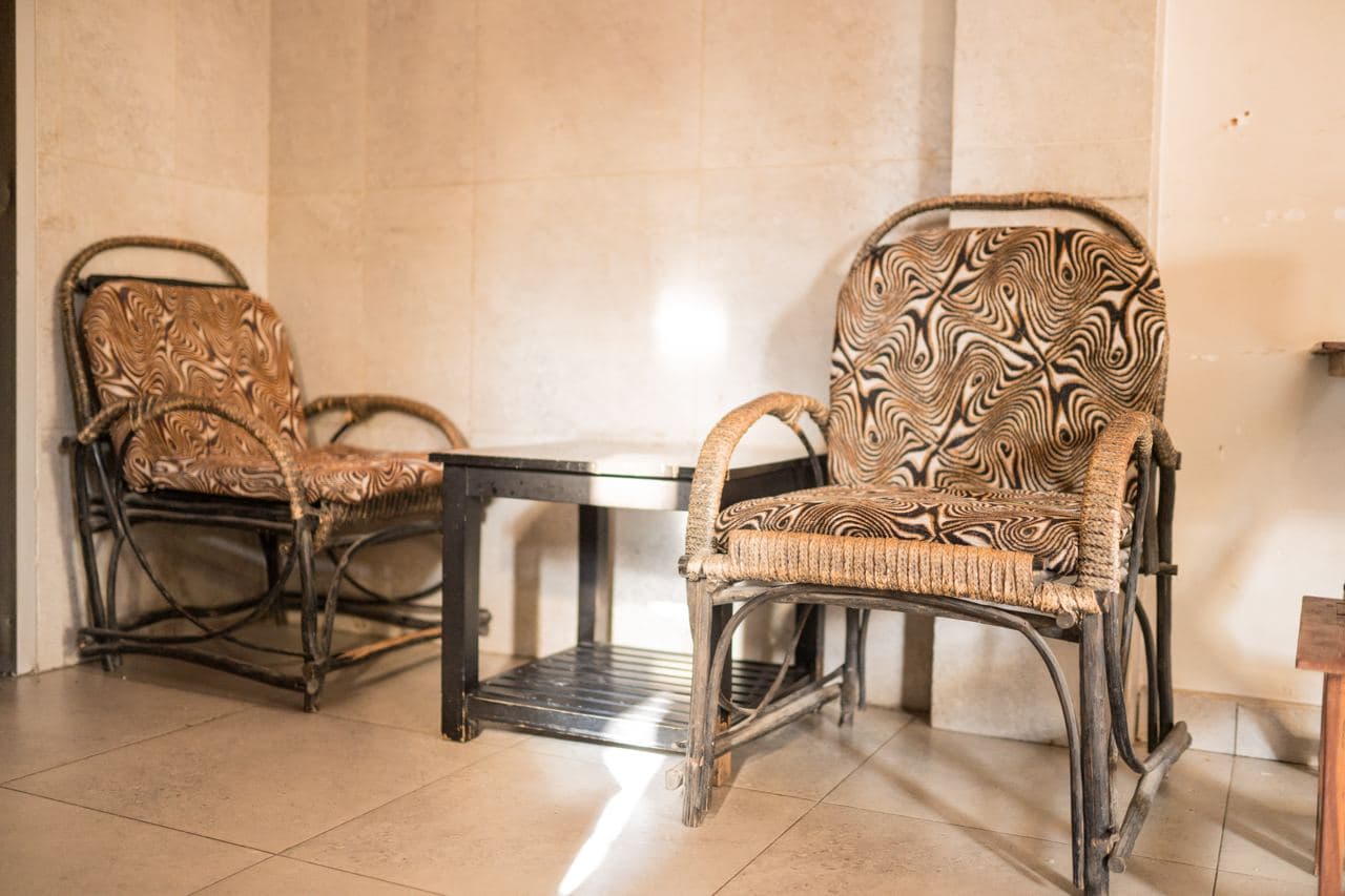 Lounge seating with wicker chairs at Mountain G Hotel